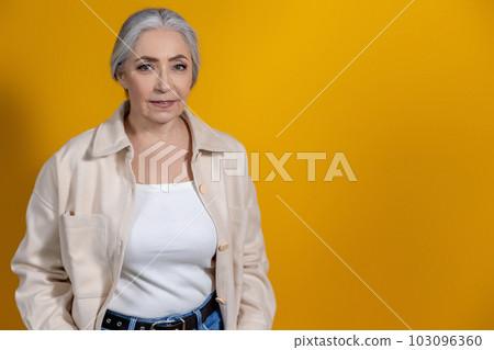 Waist up picture of a good-looking senior woman 103096360