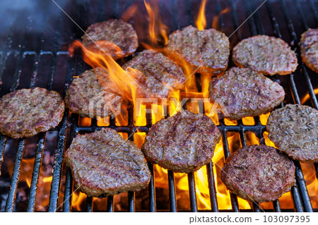 On bbq fire flame grill was prepared in order to cook grilled beef meat barbecue burgers for hamburgers 103097395