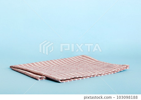 top view with red empty kitchen napkin isolated on table background. Folded cloth for mockup with copy space, Flat lay. Minimal style 103098188
