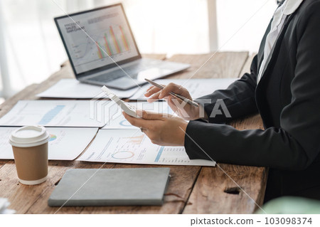 Close-up business woman hand press calculator to calculate the company financial results in the office and business work background, tax, accounting, statistics, and analytical research Close-up business woman hand press calculator to calculate the company financial results in the office and business work background, tax, accounting, statistics, and analytical research 103098374