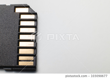 The contact group of the SD flash memory card is black on a gray background. macro close-up 103098677