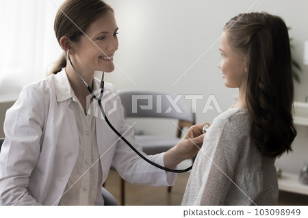 Woman pediatrician listen to little girl heart rate with stethoscope Woman pediatrician listen to little girl heart rate with stethoscope 103098949