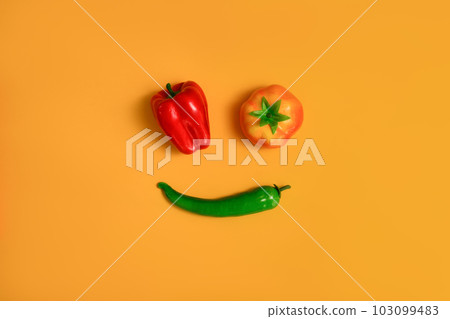 Red, yellow sweet pepper and green chili pepper isolated on yellow background. Healthy food background, vegetable concept Red, yellow sweet pepper and green chili pepper isolated on yellow background. Healthy food background, vegetable concept 103099483