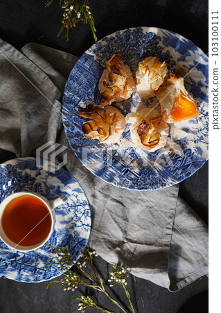 Black tea and tulhinhas - traditional Portuguese sweets Black tea and tulhinhas - traditional Portuguese sweets 103100111