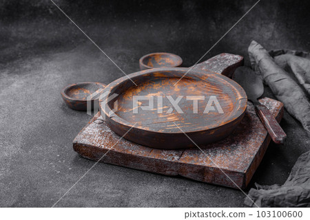 Empty wooden plate, knife, fork and cutting board Empty wooden plate, knife, fork and cutting board 103100600