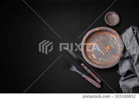 Empty wooden plate, knife, fork and cutting board Empty wooden plate, knife, fork and cutting board 103100652