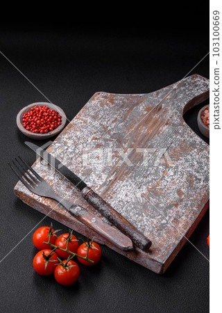 Knife, fork and cutting board, salt, pepper and other ingredients 103100669