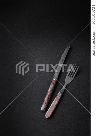 Knife, fork and cutting board, salt, pepper and other ingredients 103100721