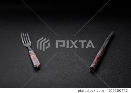 Knife, fork and cutting board, salt, pepper and other ingredients Knife, fork and cutting board, salt, pepper and other ingredients 103100722