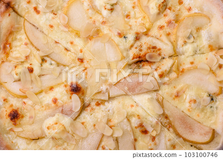 Delicious sweet pizza with pear, dorblu cheese and nuts 103100746
