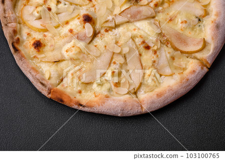 Delicious sweet pizza with pear, dorblu cheese and nuts Delicious sweet pizza with pear, dorblu cheese and nuts 103100765