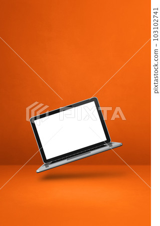 Floating computer laptop isolated on orange. Vertical background Floating computer laptop isolated on orange. Vertical background 103102741