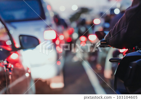 traffic jam from cars during rush hours on a city street in indonesia. A car on the highway in a traffic jam on the road. 103104605