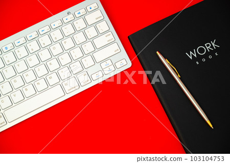 Top view photo of planners with pen and keyboard on isolated pastel red background with copyspace 103104753