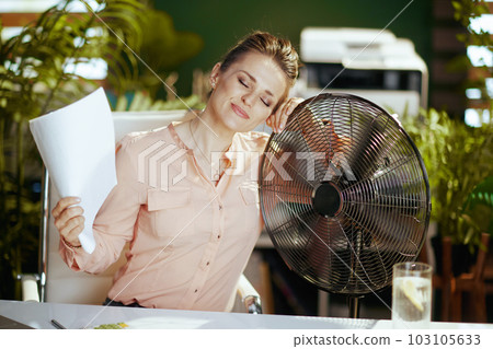 smiling modern woman worker in modern green office smiling modern woman worker in modern green office 103105633