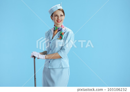 happy elegant stewardess woman on blue looking at copy space happy elegant stewardess woman on blue looking at copy space 103106232