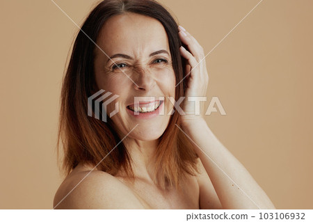 Portrait of modern woman isolated on beige background Portrait of modern woman isolated on beige background 103106932