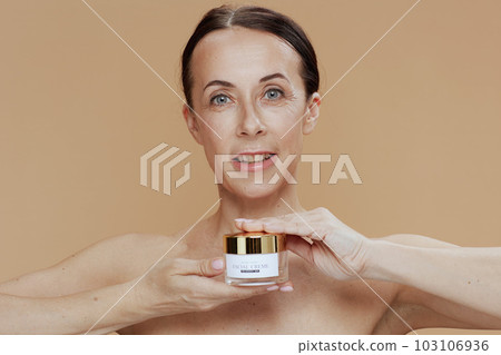 Portrait of smiling modern woman isolated on beige background Portrait of smiling modern woman isolated on beige background 103106936