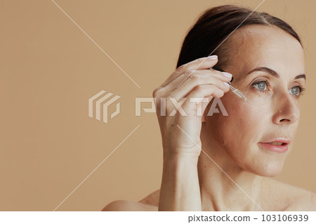 modern 40 years old woman on beige background 103106939