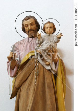Saint Joseph holding child Jesus, statue on the altar in the Church of Blessed Virgin of Purification in Smokvica, Korcula island, Croatia Saint Joseph holding child Jesus, statue on the altar in the Church of Blessed Virgin of Purification in Smokvica, Korcula island, Croatia 103108509