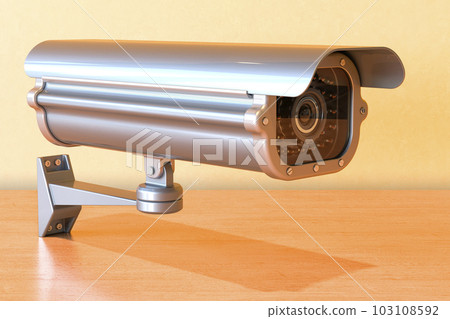 Security surveillance camera on the wooden table, 3D rendering Security surveillance camera on the wooden table, 3D rendering 103108592