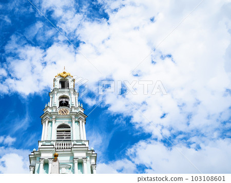 blue sky with white clousds over bell tower blue sky with white clousds over bell tower 103108601