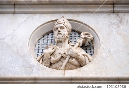 Saint, relief on the facade of Basilica of Santa Croce (Basilica of the Holy Cross) - famous Franciscan church in Florence, Italy 103108986
