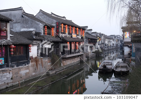 Chinese architecture and buildings lining the water canals to Xitang town in Zhejiang Province, China Chinese architecture and buildings lining the water canals to Xitang town in Zhejiang Province, China 103109047