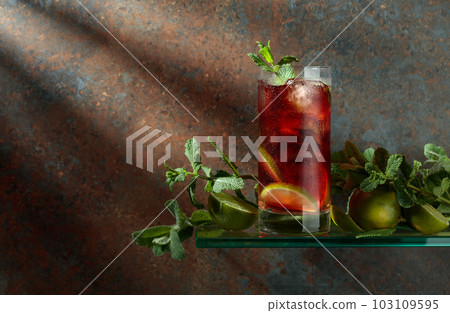 Cuba Libre with brown rum, cola, mint, and lime. Cuba Libre with brown rum, cola, mint, and lime. 103109595