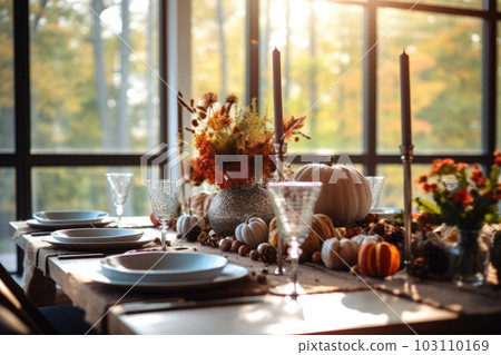 Seasonal table setting with pumpkins and flowers Seasonal table setting with pumpkins and flowers 103110169