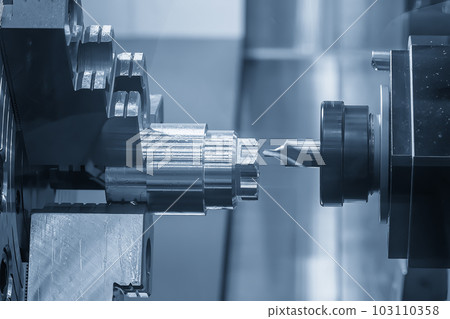 The multi-tasking CNC lathe machine  chamfer cut the metal shaft parts by milling turret. 103110358
