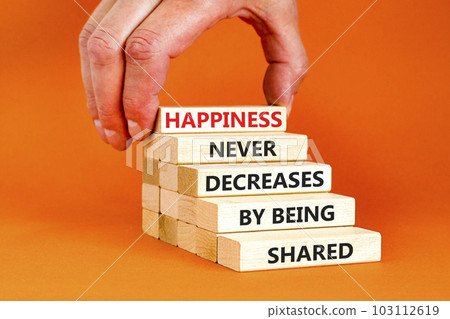 Happiness symbol. Concept words Happiness never decreases by being shared on wooden block. Businessman hand. Beautiful orange table orange background Motivational Happiness concept. Copy space. Happiness symbol. Concept words Happiness never decreases by being shared on wooden block. Businessman hand. Beautiful orange table orange background Motivational Happiness concept. Copy space. 103112619