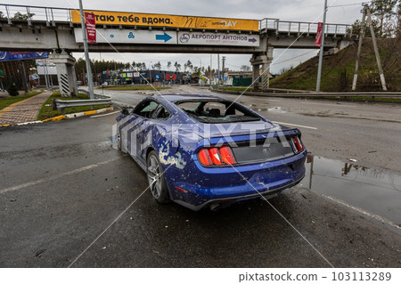 Hostomel, Kyev region Ukraine - 09.04.2022: Shot cars. On the streets of Irpin. Cities of Ukraine after the Russian occupation. Irpin, Bucha, Hostomel. Hostomel, Kyev region Ukraine - 09.04.2022: Shot cars. On the streets of Irpin. Cities of Ukraine after the Russian occupation. Irpin, Bucha, Hostomel. 103113289