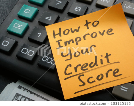 Memo stick with How to improve your credit score inscription on the calculator. Memo stick with How to improve your credit score inscription on the calculator. 103115155
