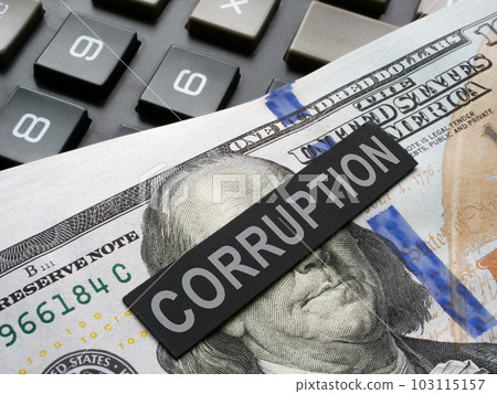 The paper with the inscription corruption lies on the dollars. The paper with the inscription corruption lies on the dollars. 103115157
