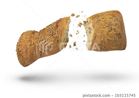 Loaf of crispy bread isolated on white. A loaf of freshly baked crispy bread is broken in half with crumbs flying in all directions at the break. Fresh baking concept. Top view. Loaf of crispy bread isolated on white. A loaf of freshly baked crispy bread is broken in half with crumbs flying in all directions at the break. Fresh baking concept. Top view. 103115745