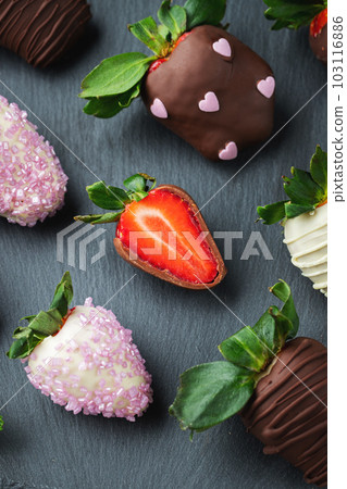 Gourmet chocolate covered strawberries on the dark background Gourmet chocolate covered strawberries on the dark background 103116886