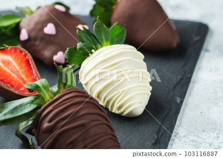 Gourmet chocolate covered strawberries on the dark background 103116887