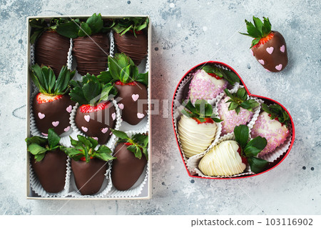 Gourmet chocolate covered strawberries on the light background. 103116902