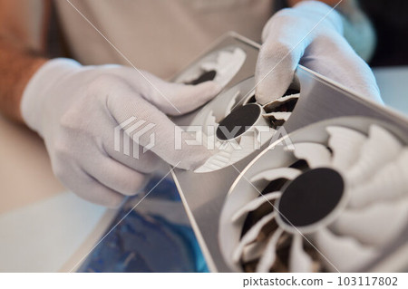 Changing the thermal paste on the graphics processor. Disassembled graphics card on the table. Old graphics card service. 103117802