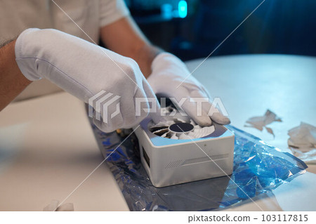 Changing the thermal paste on the graphics processor. Disassembled graphics card on the table. Old graphics card service. 103117815