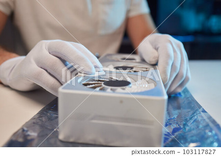 Changing the thermal paste on the graphics processor. Disassembled graphics card on the table. Old graphics card service. 103117827