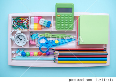 Stylish colored stationery and school supplies in the organizer. Creative organization of stationery storage. Concept back to school