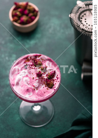 Summer pink cocktail with rose flowers 103118985