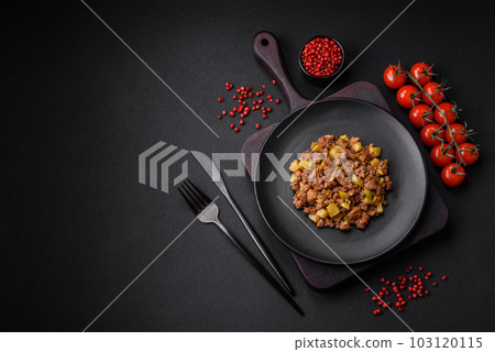 Tasty dish consisting of zucchini, beef meat, mushrooms, onions and garlic 103120115