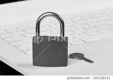 Padlock with a key on a laptop as a concept of protecting information in cyberspace Padlock with a key on a laptop as a concept of protecting information in cyberspace 103120131