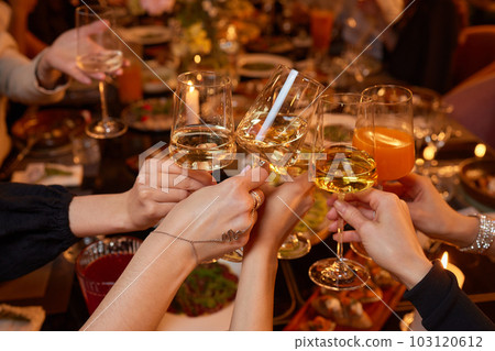 Clinking glasses with alcohol and toasting, party. 103120612