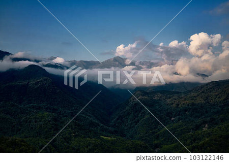 Mountain ranges on a sunny day at Georgia. Sky with clouds adn hills Mountain ranges on a sunny day at Georgia. Sky with clouds adn hills 103122146