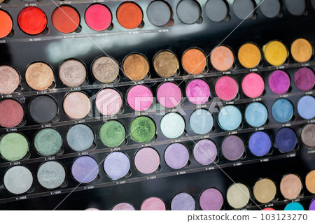 Pallet with vibrant eyeshadow for make up in cosmetic store 103123270