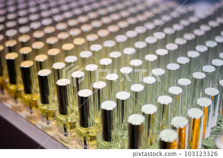 Set of cuticle oil with different smells on shelves of cosmetic store 103123326